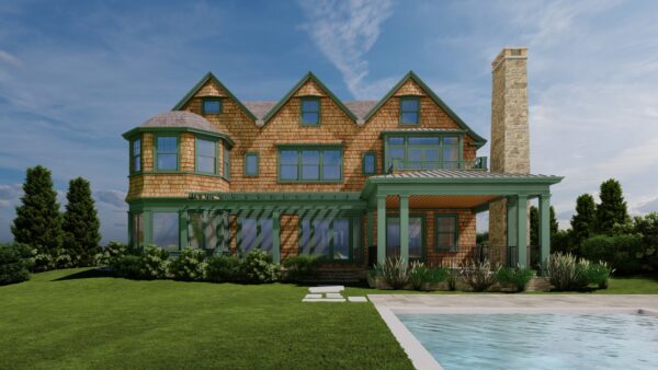 A large, elegant house with a gabled roof, shingle siding, and expansive windows stands against a cloudy sky. It features a chimney and a covered porch with green accents. In the foreground is a stone path leading to a pool, surrounded by lush green grass and shrubs.