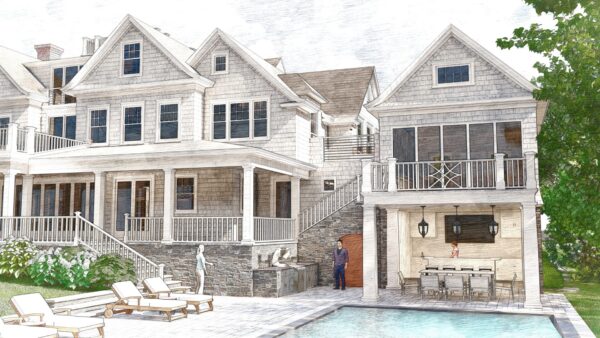 A large, elegant Colonial Revival house with gray shingles and white trim overlooks a coastal patio with lounge chairs, a pool, and an outdoor kitchen. One person relaxes by the pool while another stands near the bar. A screened balcony sits above the kitchen.